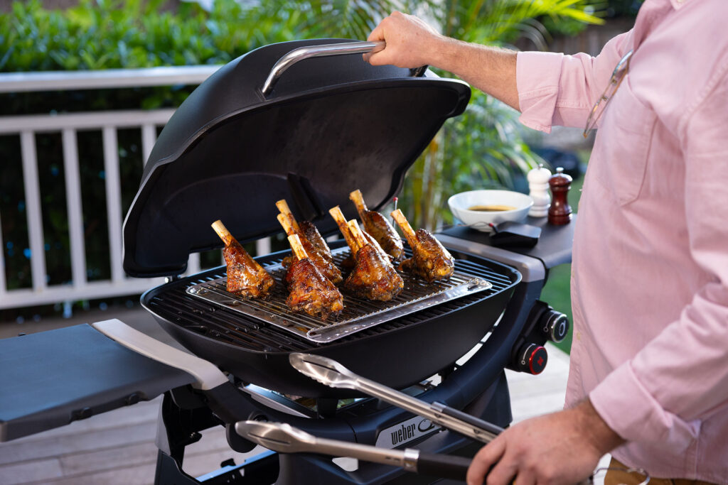 Meat on the bone being cooked on a BBQ